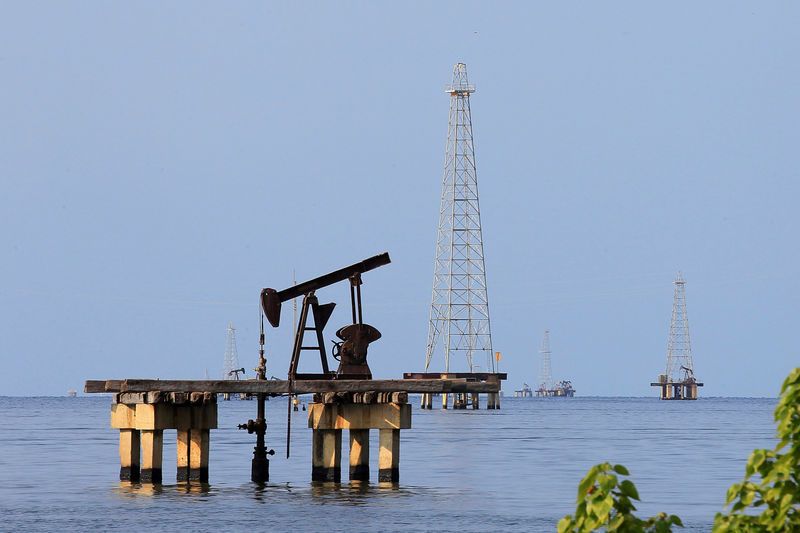 Oil edges up on Venezuela and Iran sanctions, OPEC supply cuts