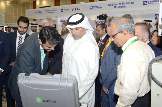Dr Bin Daina touring an exhibition on the sidelines of the conference