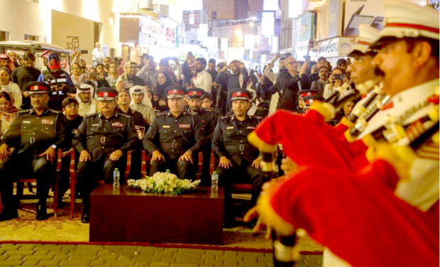 <p><em><strong>Director-General Brigadier Al Qattan, seated third from left, watching the parade</strong></em></p><p>A large number of citizens and residents gathered at Bab Al Bahrain to witness the Bahrain Police Parade, organised by the Interior Ministry to celebrate National Day. The event, held in the presence of Capital Governorate Police Director-General Brigadier Isa Al Qattan, featured a band performing national musical pieces that reflected Bahrain’s rich cultural identity. The parade showcased exceptional discipline, efficiency and readiness, highlighting the professionalism of the Bahrain Police.</p><div class="explain-selected-button explain-selected-circle"></div><style>
.explain-selected-button.explain-selected-text-selected-show-button {
  display: block !important;
}

.explain-selected-button.explain-selected-expanded {
  width: 400px;
  border: 0px;
  cursor: default; 
  height: 350px; 
  overflow: auto;
  box-shadow: rgba(15, 15, 15, 0.05) 0px 0px 0px 1px, rgba(15, 15, 15, 0.1) 0px 3px 6px, rgba(15, 15, 15, 0.2) 0px 9px 24px;
}

.explain-selected-button.explain-selected-circle:not(.explain-selected-expanded) {
  width: 35px;
  height: 35px;
  background: transparent;
  border-radius: 50%;
  opacity: 0.5;
}
.explain-selected-button.explain-selected-circle:not(.explain-selected-expanded):hover::before {
  content: "";
  position: absolute;
  width: 35px;
  height: 35px;
  background-color: rgba(128, 0, 128, 0.5);
  border-radius: 50%;
  top: 50%;
  left: 50%;
  transform: translate(-50%, -50%);
  animation: explain-selected-growAndFade 2.0s ease-in-out;
  animation-iteration-count: infinite;
}

.explain-selected-button.explain-selected-circle:not(.explain-selected-expanded)::after {
  content: "";
  position: absolute;
  width: 10px;
  height: 10px;
  background-color: rgb(128, 0, 128);
  top: 50%;
  left: 50%;
  transform: translate(-50%, -50%);
  border-radius: 50%;
}
.explain-selected-button.explain-selected-circle:not(.explain-selected-expanded):hover::after {
  width: 14px;
  height: 14px;
}

@keyframes explain-selected-growAndFade {
  0% {
    width: 10px;
    height: 10px;
    opacity: 1;
  }
  100% {
    width: 30px;
    height: 30px;
    opacity: 0;
  }
}

.explain-selected-button {
  display: none !important;
  width: 120px;
  height: 28px;
  border-radius: 4px;
  border: 0px;
  position: absolute;
  z-index: 9999;
  opacity: 1;
  cursor: pointer;
  background: white;
  text-align:left;
  font-family: Tahoma,Arial,Helvetica Neue,Helvetica,sans-serif; 
  background-color: #fff;
  color: #333;
}

.swal2-icon-show-explainselected {
  border: none;
}

.swal2-container p {
  margin: 0 !important;
}

</style>