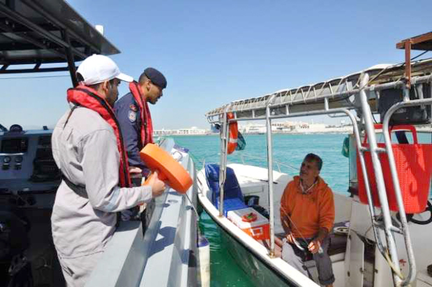Coastguard officers educating a seafarer.