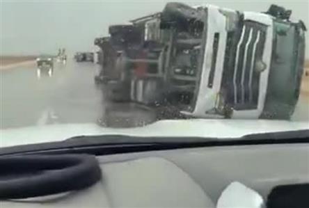 Severe winds flip trucks and knock down poles...
