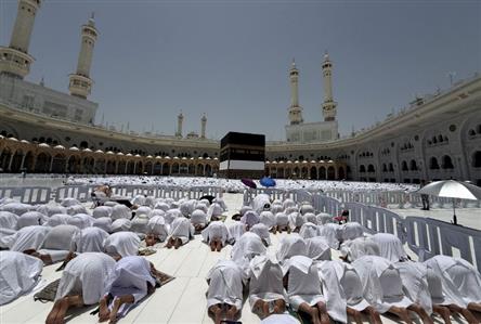 Muslim pilgrims circle Mecca’s Grand Mosque...