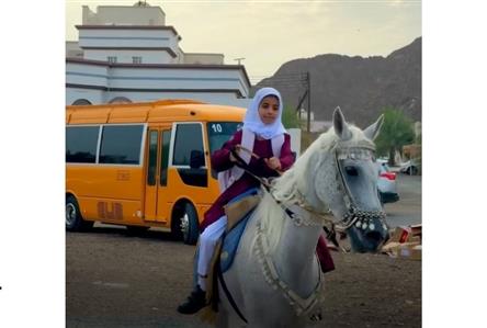 Omani girl rides horse to first day of school...