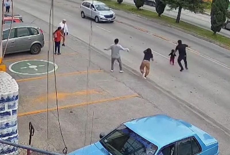 OMG: CCTV shows moment child is saved from oncoming cars in Mexico
