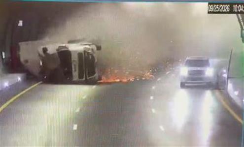 WATCH: Family narrowly escapes overturned truck...