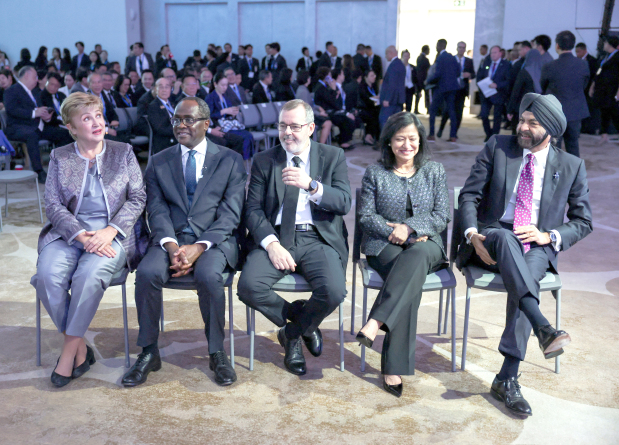 International Business : IMF chief urges co - operation on AI and war risks